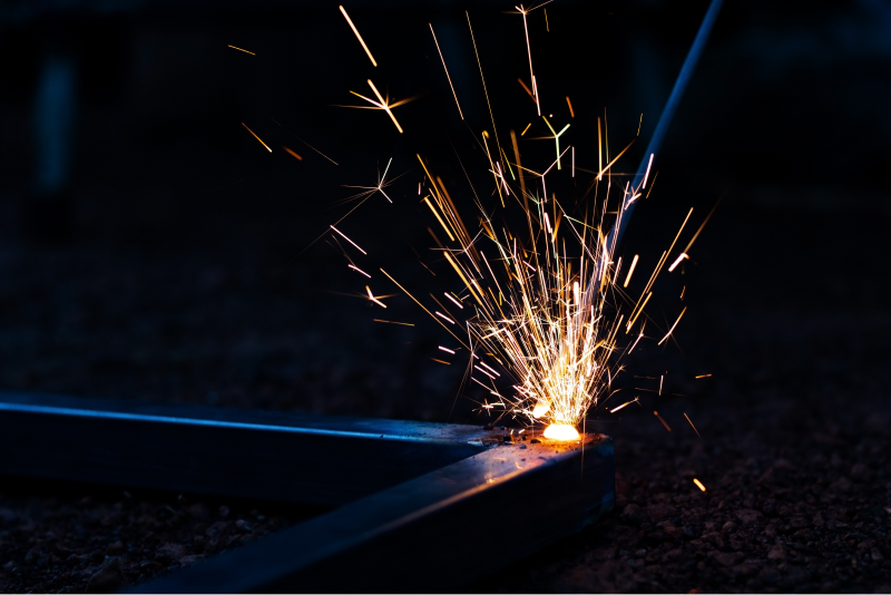 technician-focus-welding-process-spark-light-with-equipment 1.png